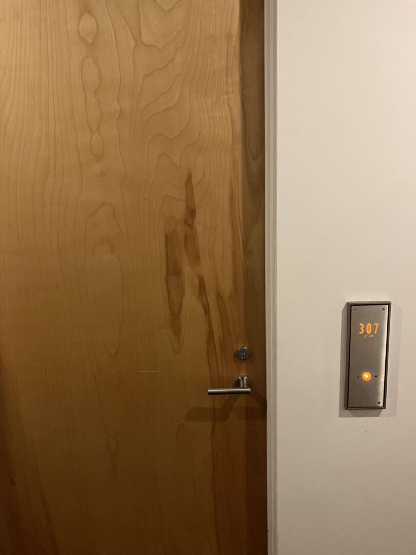 A door with the light on and no one in it