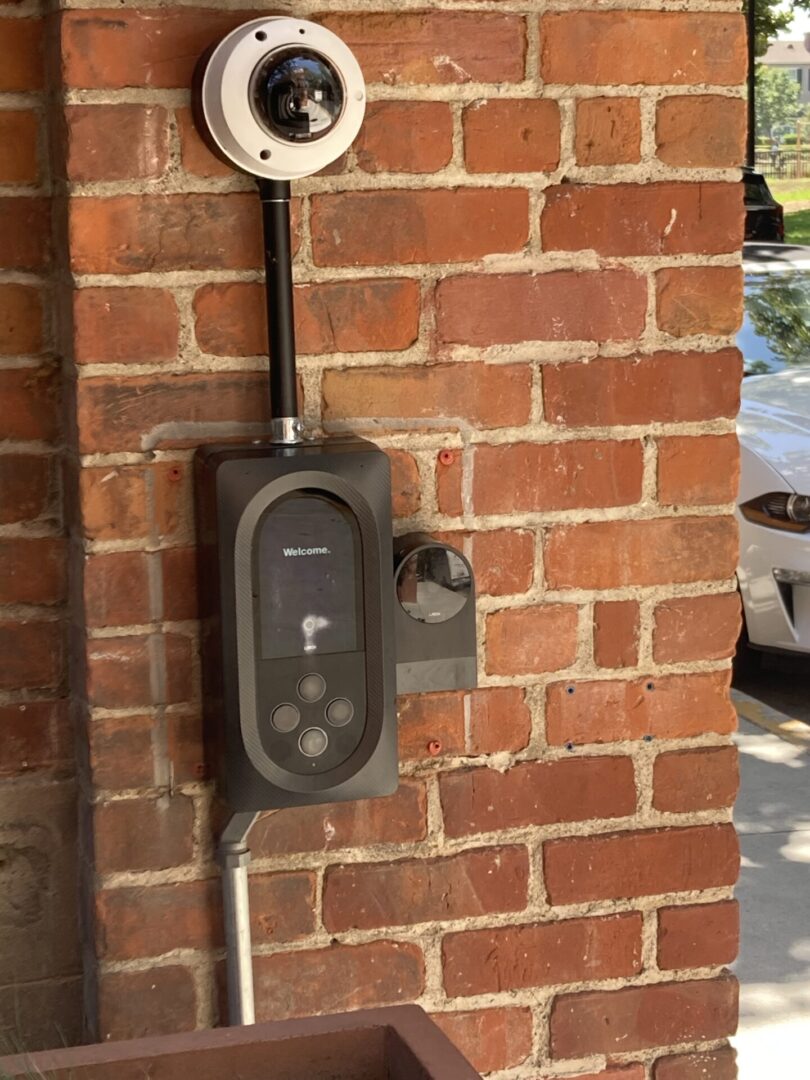 A brick wall with a meter and a coin meter