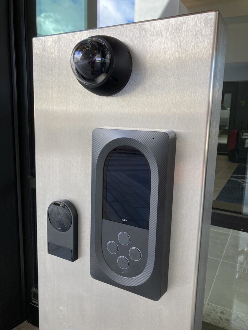 A door knob with a digital camera on it.